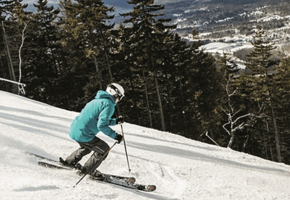 A skier going downhill at Loon Mountain